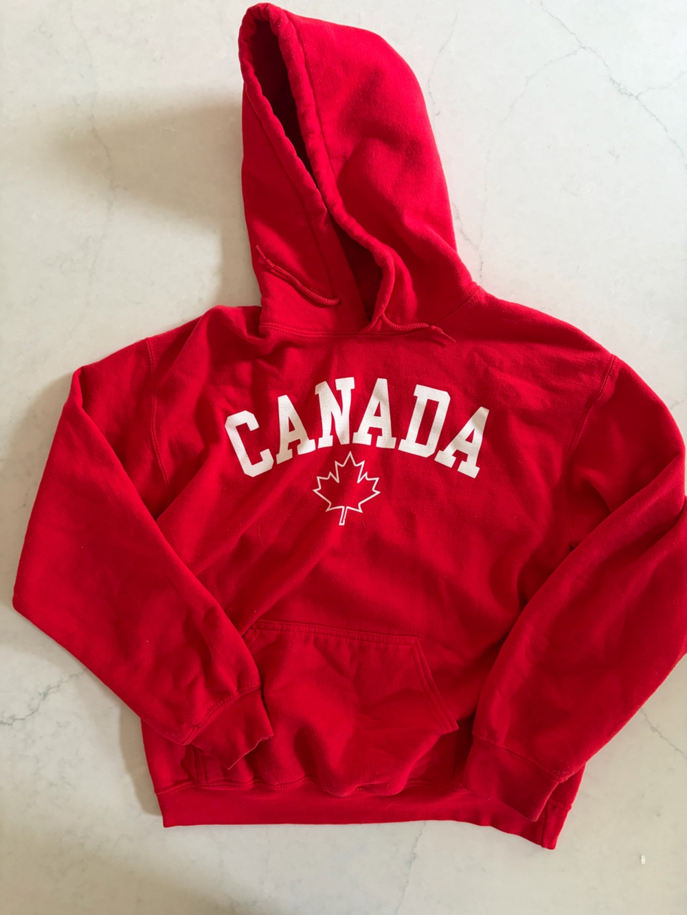 Red Vintage CANADA Hoodie with White Maple Leaf Graphic